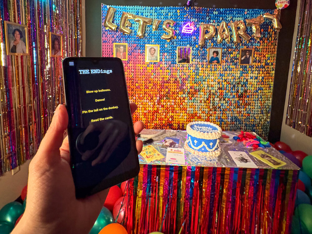 a phone with options in front of a party room with cake on a table